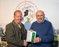 Dominic Reddin, FIPF presenting an Honourable Mention Certificate to Sheamus O'Donoghue, LIPF