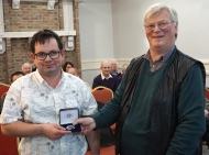 Martin Tobin receiving his Silver Medal from Edwin Bailey, LIPF
