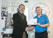 IPF President Michael O'Sullivan presenting 3rd Place Colour Club Award to Limerick Camera Club accepted by Padraic Charlton