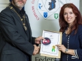 IPF President Michael O'Sullivan presenting LIPF distinction to Sigita Playdon.jpg