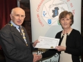 Sheamus O'Donoghue presenting Maria O'Brien with 2 Honourable Mention certificates in the Intermediate Section