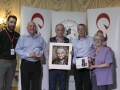 Philip Desmond from Canon Ireland, judges Sandy Cleland, Leo Palmer and Peter Gennard along with IPF Vice-President Lilian Webb pictured with overall winning image and some of the prizes its author receives.jpg